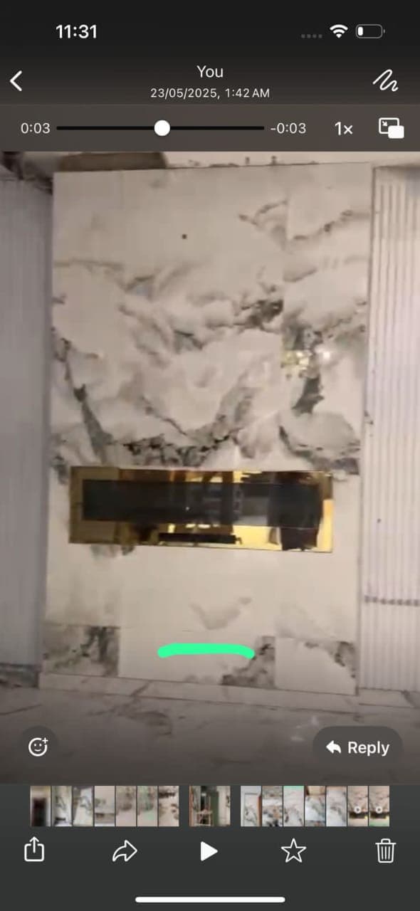 Linear electric fireplace feature wall in progress clad in bookmatched marble porcelain slabs in F-6 / F-7 Islamabad