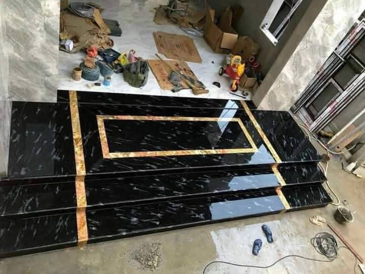 Black marble entrance steps with brass inlay detail, Islamabad
